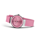 Pink BERING wristwatch with silicone strap, three-quarter view showing dial and case from angled perspective.