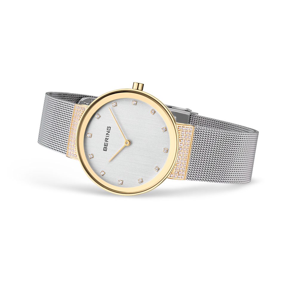 Two-tone BERING watch with white dial and mesh steel band, angled side view.