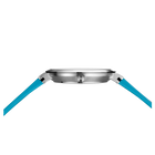 BERING wristwatch with silver case and turquoise band, side profile view