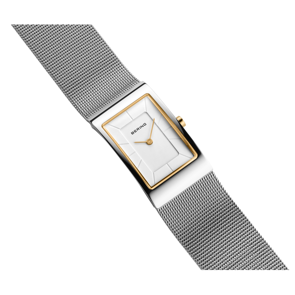 Reloj rectangular con esfera blanca, caja oro rosa y pulsera malla gris oscuro, vista angular