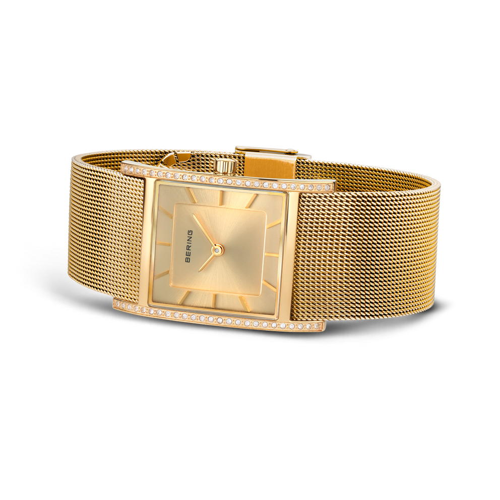Square champagne dial with mesh bracelet, shown at side angle