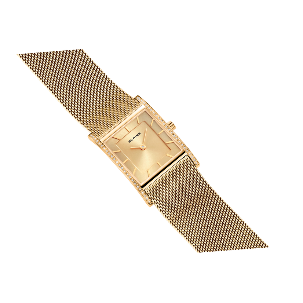 Square gold wristwatch with mesh band, displayed at an angle on white background.