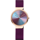 Reloj BERING Anniversary con caja de oro rosa, esfera iridiscente degradada y correa malla púrpura.