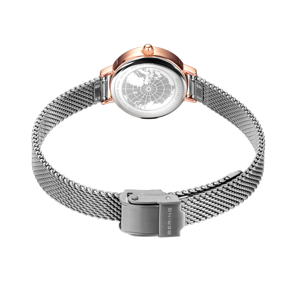 Vista trasera del reloj BERING 11022-064 con caja de oro rosado y pulsera de malla plateada con cierre magnético.