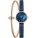 BERING watch with navy dial and rose gold case displayed with navy mesh and rose gold metal interchangeable straps