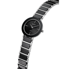 Orologio da polso nero con quadrante rotondo e indici radiali, bracciale a maglie bicolore nero e argento