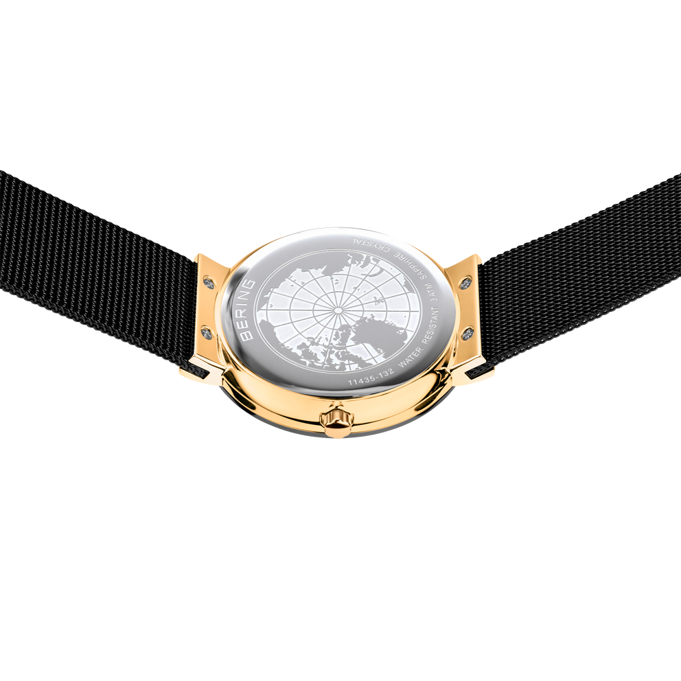 Montre-bracelet avec cadran carte du monde, boîtier argenté avec éléments dorés et bracelet textile noir