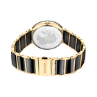 Retro dell'orologio con fondello trasparente che mostra il meccanismo, cinturino nero e oro