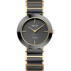 Orologio bicolore nero e oro con quadrante a motivo radiale, lancette dorate e bracciale a maglie.
