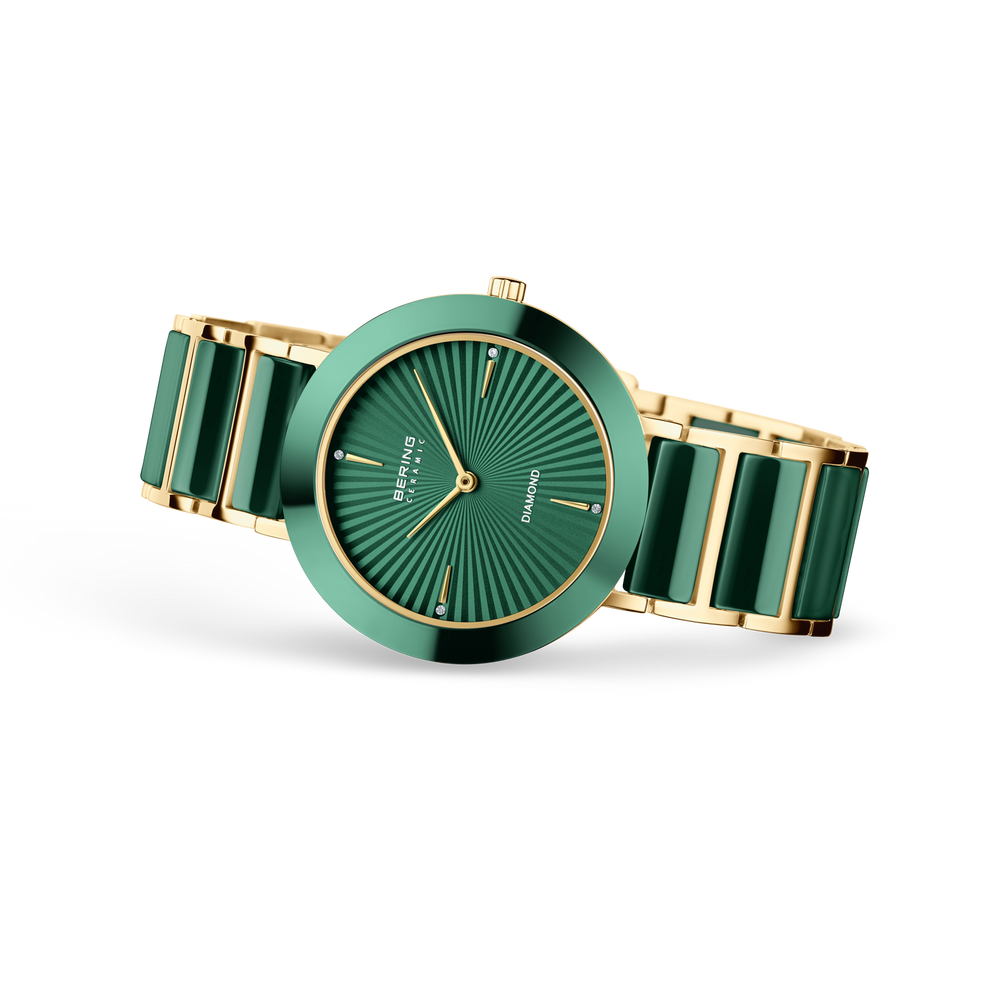 Orologio turchese con quadrante a raggi e cinturino bicolore, vista laterale
