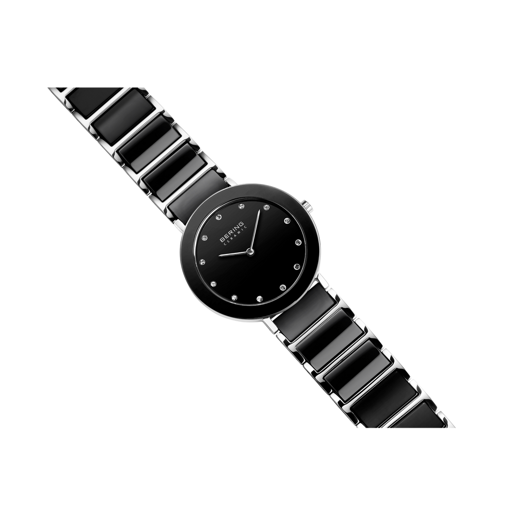 Orologio da polso nero minimalista con quadrante rotondo e cinturino segmentato