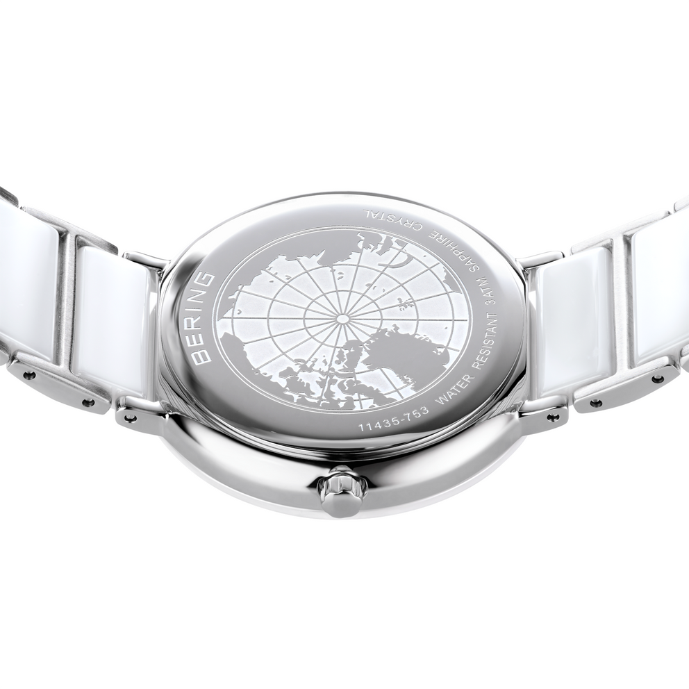 Silver-tone wristwatch with globe-etched dial face and matching metal bracelet, viewed from above.