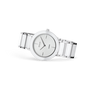 Silver wristwatch with round white dial, radial index markers, and metal bracelet, side view