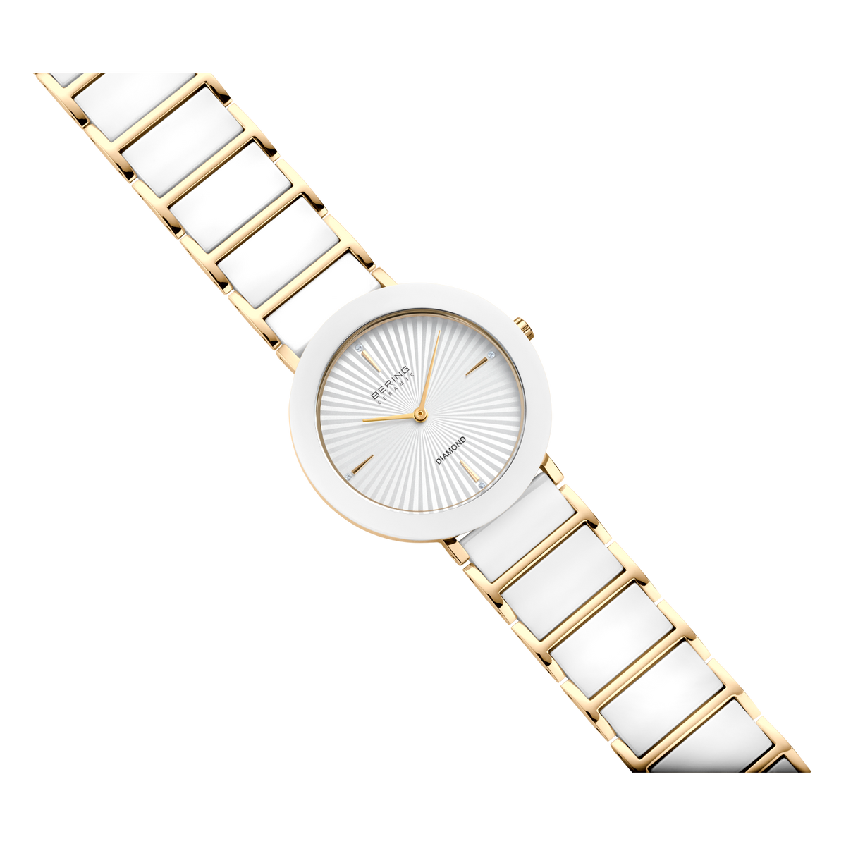 Round watch with white dial, gold-toned hands and mesh band, shown at diagonal angle