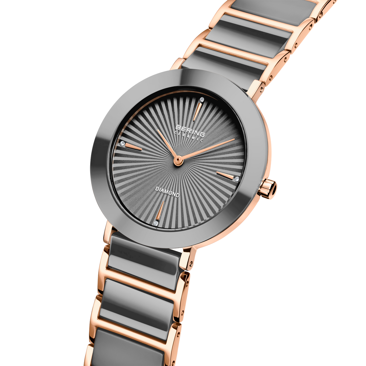 Orologio angolato con quadrante grigio a raggi solari, cassa oro rosa e cinturino con maglie grigie e oro rosa.