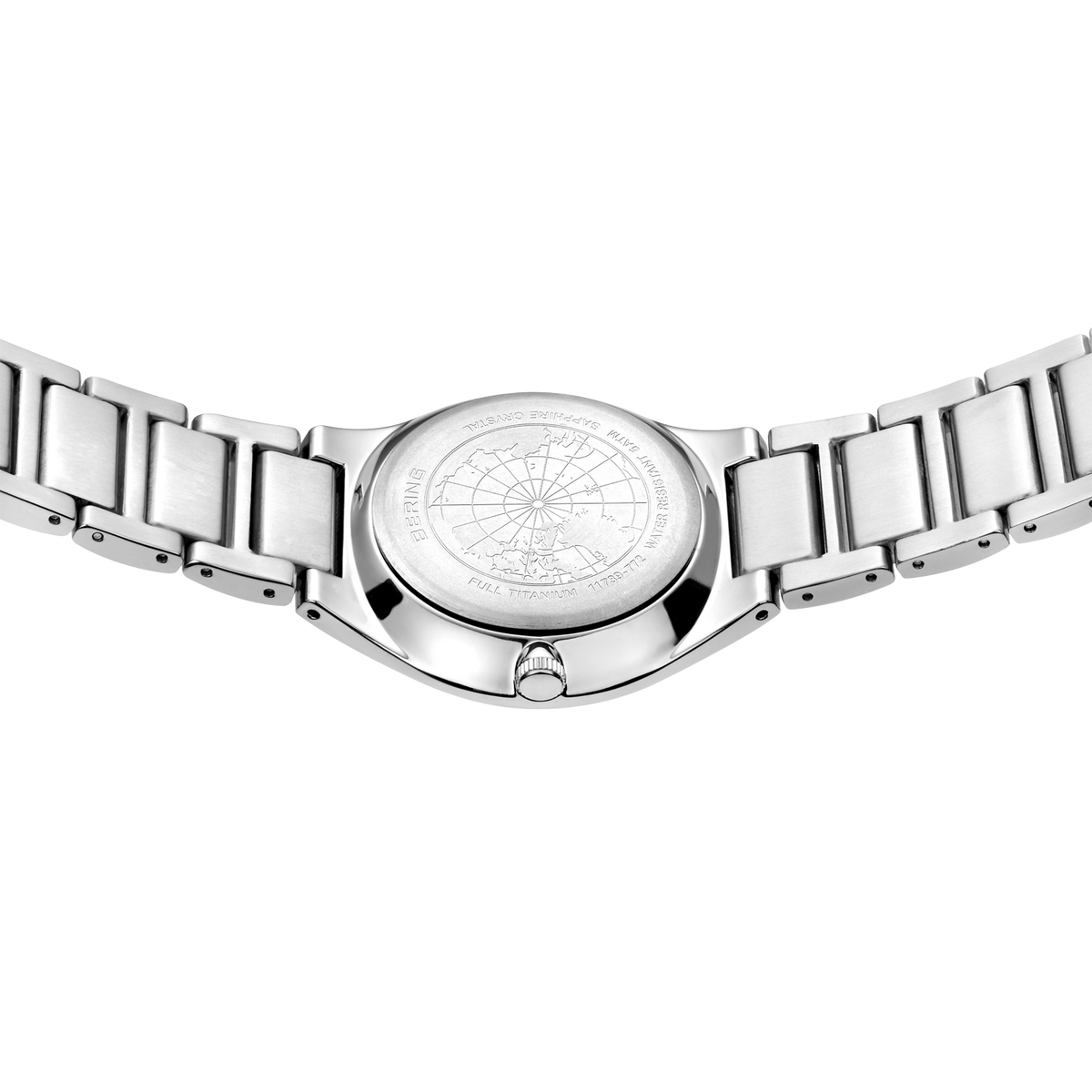 Stainless steel watch viewed from below, showing detailed compass-rose dial and linked metal bracelet