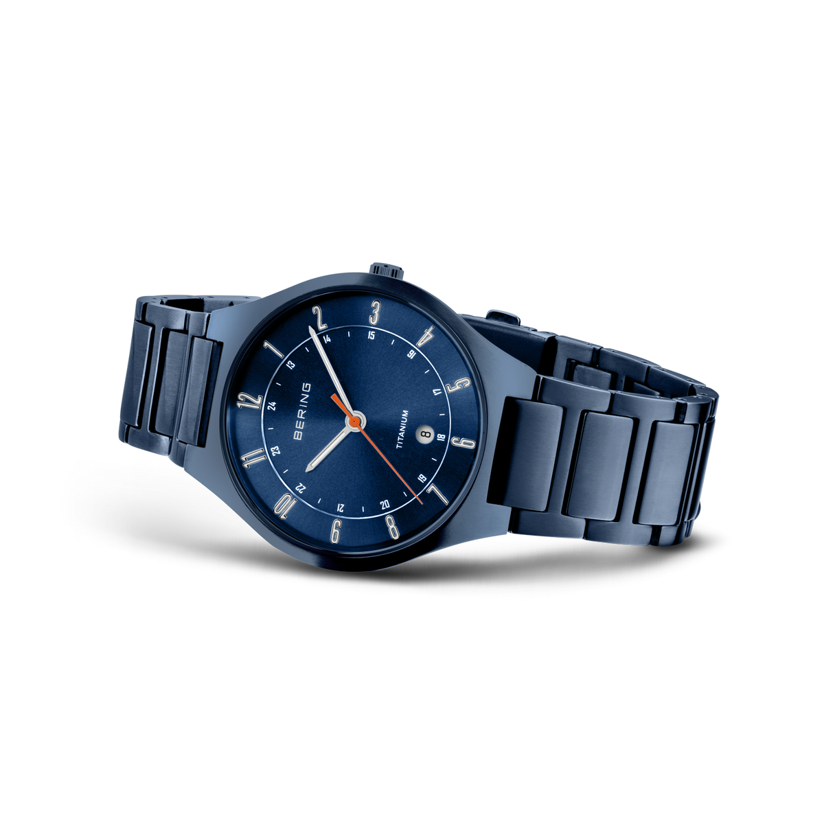 Dark blue steel watch with matching bracelet and blue dial with white hour markers, shown from an angle