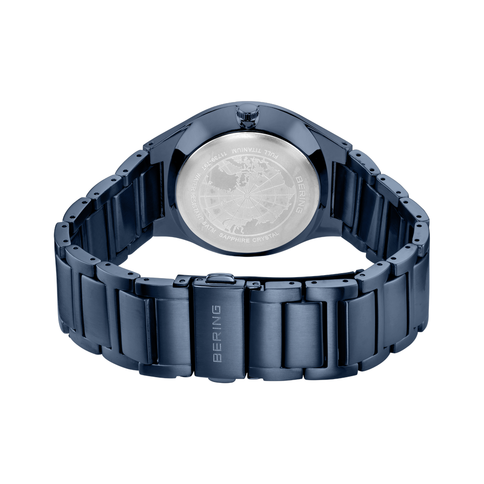 Dark blue metal watch bracelet and caseback, with BERING branding visible on the band.