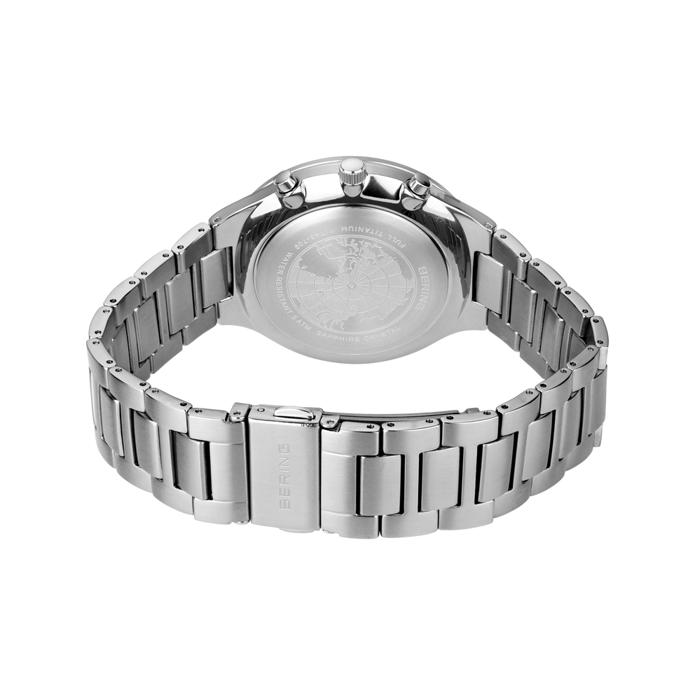 Rear view of stainless steel watch with metal link bracelet and case back.