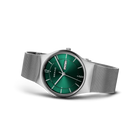 BERING wristwatch with silver mesh bracelet and dark green dial with white hands, angled view
