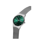 Silver rectangular wristwatch with teal dial and mesh bracelet, side-angle view