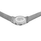 BERING wristwatch viewed from the back, showing the case back and silver mesh band.