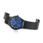 BERING titanium watch from angled view, blue dial and black mesh band.