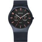 Montre BERING, cadran rond noir avec marqueurs et aiguilles or rose, bracelet maille bleu foncé