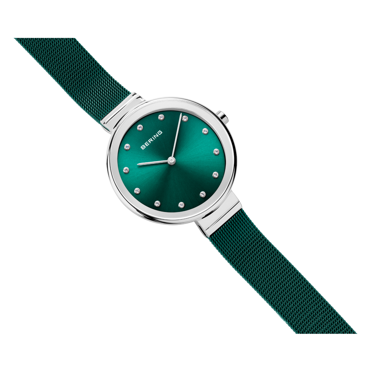 Wristwatch with teal dial, white hour markers, silver case, and textured fabric strap angled across frame.