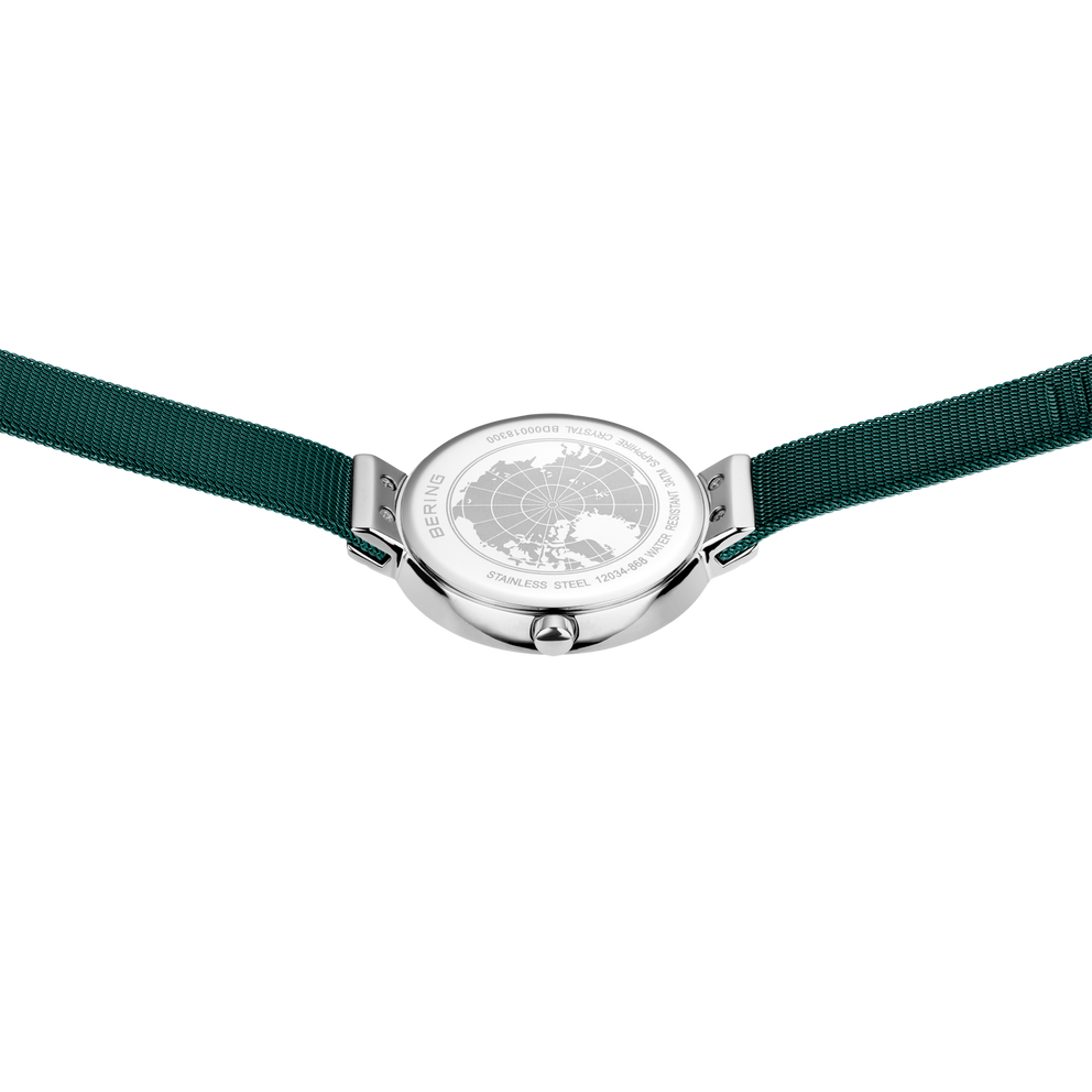 Watch viewed from back with dark green textile straps and silver-toned case