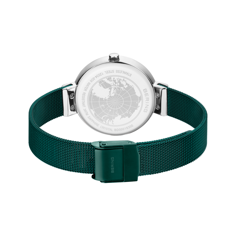 Back view of BERING wristwatch showing silver caseback and dark teal textile strap with clasp.
