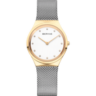 Round gold watch with white dial, dot indices, BERING text, gold hands, and silvery mesh metal bracelet.