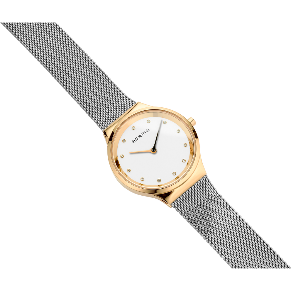 Rose gold watch with white dial and grey mesh band, angled view