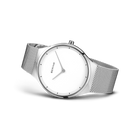 BERING watch with cream dial, angled to show the stainless steel mesh band and minimalist design
