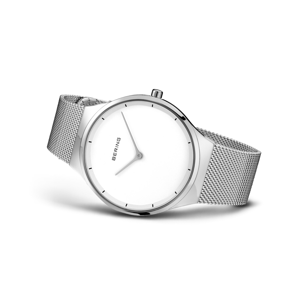 BERING watch with cream dial, angled to show the stainless steel mesh band and minimalist design