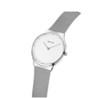 BERING round wristwatch with white dial, silver case and mesh bracelet, tilted three-quarter view