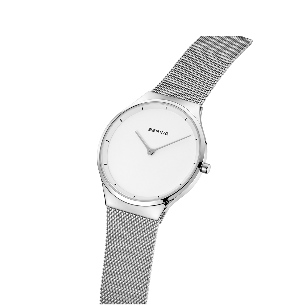 BERING round wristwatch with white dial, silver case and mesh bracelet, tilted three-quarter view