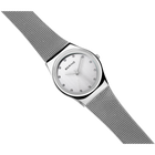 BERING watch positioned diagonally, highlighting the stainless steel mesh band and case profile.