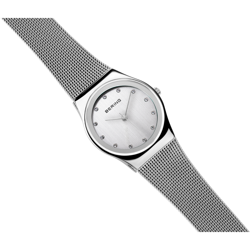 BERING watch positioned diagonally, highlighting the stainless steel mesh band and case profile.