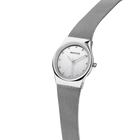 BERING watch with mesh band draped upward, demonstrating the band's flexibility and movement.