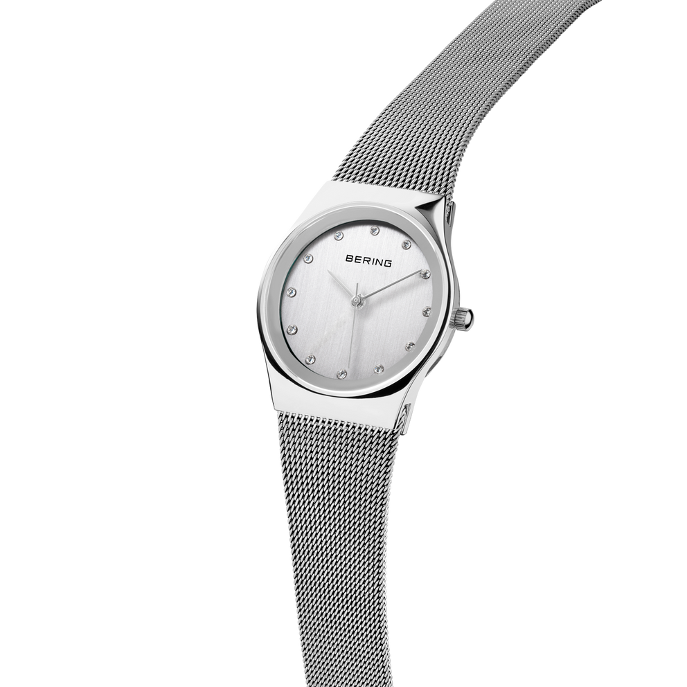 BERING watch with mesh band draped upward, demonstrating the band's flexibility and movement.
