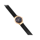 Round-faced wristwatch with dark dial, gold-tone case, and black leather strap displayed at angle.