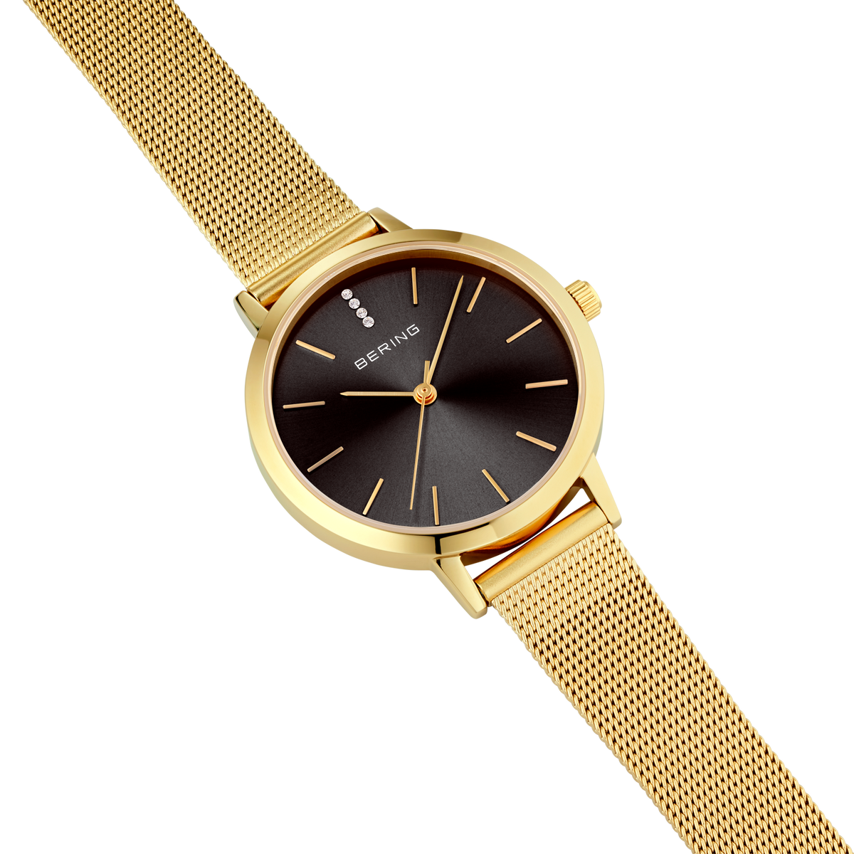 Gold mesh wristwatch with black dial and slender indexes, viewed at angle