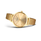 BERING wristwatch with gold round case and mesh metal band, side view