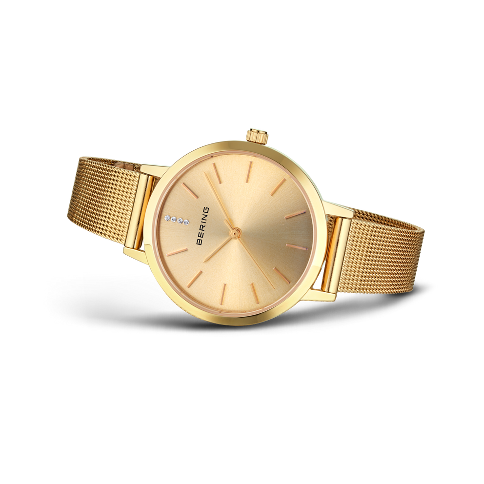 BERING wristwatch with gold round case and mesh metal band, side view