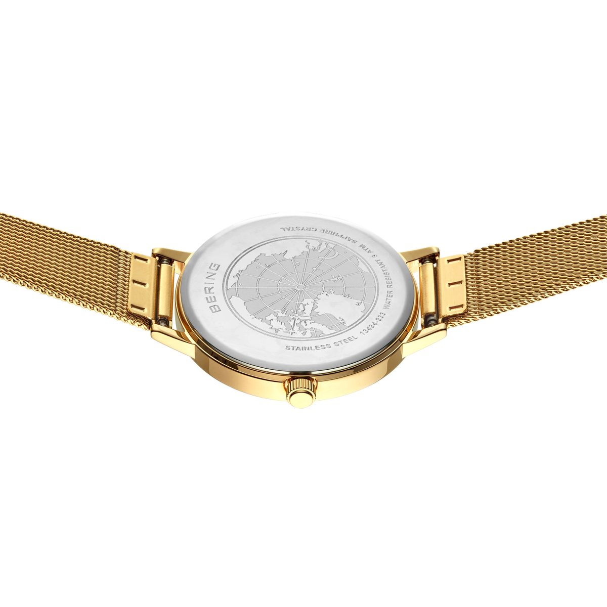 BERING watch case back with gold mesh bracelet, showing engraved case details and gold-colored lugs