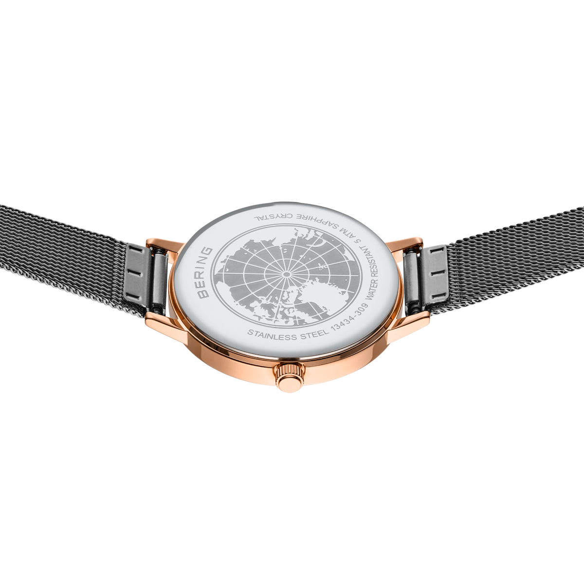Vue de dessus de la montre or rose avec cadran blanc et bracelet maille noir