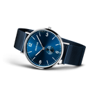 BERING wristwatch with blue dial, Arabic numerals, and navy fabric strap, three-quarter view