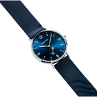BERING wristwatch with blue dial, silver case, and blue mesh bracelet, shown at diagonal angle.