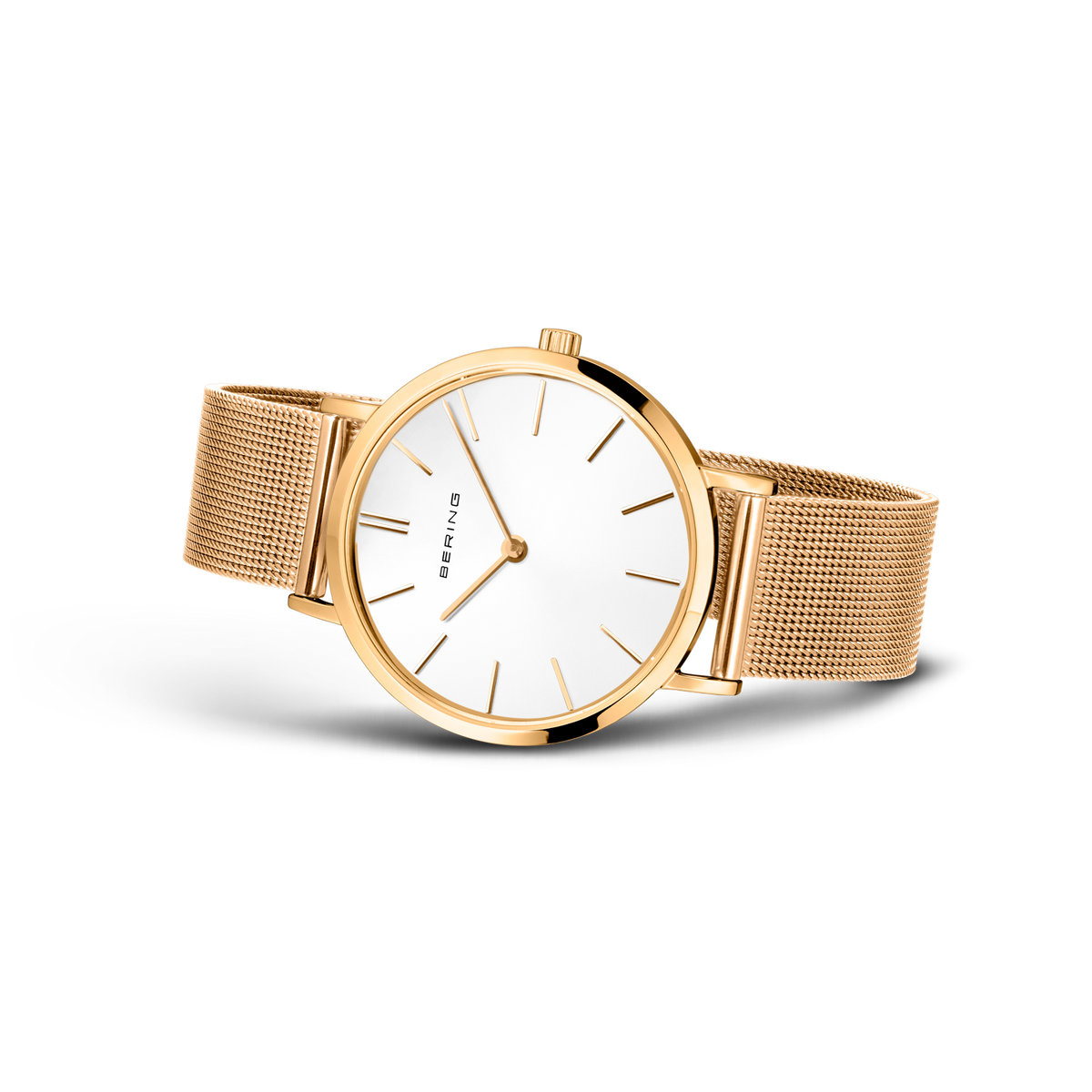 Gold wristwatch with round white dial and mesh bracelet, angled view